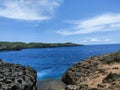 Beautiful view of reef, stone, ocean, and sky. The mixture of beautiful element ini nature make it wonderfull