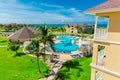 beautiful view of resort grounds, swimming pools with people relaxing and enjoying their vacation time Royalty Free Stock Photo