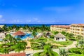 Beautiful view of resort grounds, swimming pools with people relaxing and enjoying their vacation time Royalty Free Stock Photo