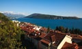 Beautiful view of resort town by the sea, in bay among green mountains and clear blue sky, Montenegro, Herceg Novi