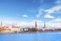 Beautiful view of the Riga Castle, St. Peter`s Church and the tower of the Dome Cathedral on the banks of the Daugava River Royalty Free Stock Photo