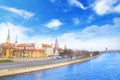 View of the Riga Castle, St. Peter`s Church and the tower of the Dome Cathedral on the banks of the Daugava River in Riga Royalty Free Stock Photo