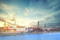 View of the Riga Castle, St. Peter`s Church and the tower of the Dome Cathedral on the banks of the Daugava River in Riga Royalty Free Stock Photo