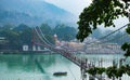 Beautiful view of Rishikesh in India `ram jhula` and `lakshman jhula` suspension bridge beautiful scenery with boat in the river g
