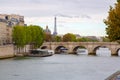 Beautiful view of the river Saine with the Eiffel tower on the left in Paris, France Royalty Free Stock Photo