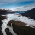 Beautiful view of river surrounded by snow-peaked mountains in New Zealand