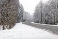 Beautiful view of the road in the winter forest. Royalty Free Stock Photo