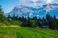 Beautiful view of the rocky Alps under the cloudy blue sky in France