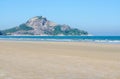 Beautiful view of a rocky cliff by the sea under a bright sky Royalty Free Stock Photo