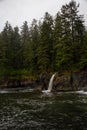 Beautiful View of a rocky coast with waterfall on the Juan de Fuca Trail