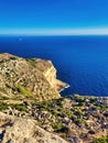 Beautiful view of rocky coastline. A picture paints a thousand words. Amazing sea and mountains. Cliff, ocean. A sunny day with Royalty Free Stock Photo