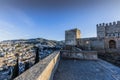Beautiful view of a rooftop wall of a part of the Alhambra with the city of Granada in the background Royalty Free Stock Photo
