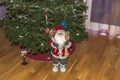 Beautiful View Of Room With Christmas Decoration Cute Santa Clause Figure And Nutcracker On Pine Tree Background.