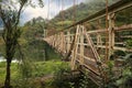Beautiful view on rusty metal bridge over river in mountains Royalty Free Stock Photo
