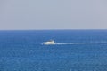 Beautiful view of sailing yacht in sea. Blue sea water surface and blue sky background. Royalty Free Stock Photo