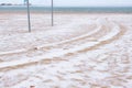 Beautiful view of the sand and snow storm on the beach in winter. Sea port. Royalty Free Stock Photo