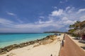 Beautiful view of the sandy beach of the Caribbean Sea with a hotel located on the shore. Royalty Free Stock Photo