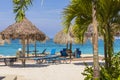Beautiful view of sandy beach of Caribbean sea with sun loungers and parasols. Royalty Free Stock Photo