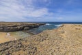 Beautiful view of sandy beach between rocks in Caribbean Sea on island of Aruba Royalty Free Stock Photo