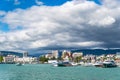 Beautiful view of the sea Bay with yachts near the shore and thick clouds in the sky.