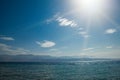 Beautiful view of the sea and mountains with sun rays.