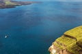 Beautiful view of the sea, the ship, the volcano on a warm sunny day. Royalty Free Stock Photo