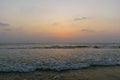 Beautiful view of sea waves flowing into sand at Baga beach in Goa, India Royalty Free Stock Photo