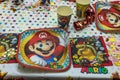 Beautiful view of served table with Mario theme decoration prepared for party.