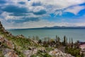 Beautiful view of Sevan lake with turquoise water and green hills, Sevan, Armenia. May 6, 2019. Royalty Free Stock Photo