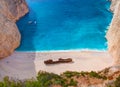 Beautiful view on Shipwreck beach in amazing bay, boats and ships with swimming people in Ionian Sea blue water, Blue Caves shipwr