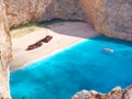 Beautiful view on shipwreck beach travel sightseeing boat swimming tourists in blue water of Ionian Sea near to Blue Caves and Nav