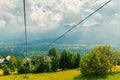 beautiful view from the ski lift during the descent to the valley with houses and mountains