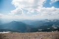 A beautiful view of the snow-capped mountains of the Carpathians from the top of Goverly in spring in a beautiful sunny day with l