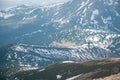 A beautiful view of the snow-capped mountains of the Carpathians from the top of Goverly in spring in a beautiful sunny day with l