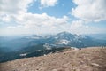 A beautiful view of the snow-capped mountains of the Carpathians from the top of Goverly in spring in a beautiful sunny