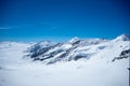 Beautiful view of snow mountain above cloud with clear blue sky looking from viewpoint, Jungfrau, Switzerland Royalty Free Stock Photo