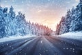 Beautiful view of the snowy curve country road in snowfall Royalty Free Stock Photo