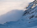 A beautiful view of the snowy mountain above the clouds Royalty Free Stock Photo