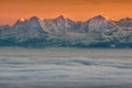 Beautiful view of snowy mountain peaks above clouds Royalty Free Stock Photo