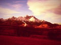 Sunset in mountains .Beautiful view of snowy mountains from beautiful blue sky and clouds