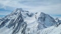 Beautiful view of a snowy mountaintop under the cloudy sky