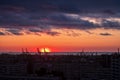 Sunset over industrial seaport, urban landscape Royalty Free Stock Photo