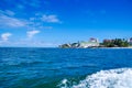 Beautiful view of some buildings in the horizont with a gorgeos blue water in San Andres Island during a sunny day in Royalty Free Stock Photo