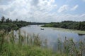 Beautiful view of a Sri Lankan river landscape with a man on an Outrigger boat Royalty Free Stock Photo