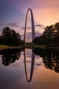 Beautiful view of St Louis gateway arch with a reflection on a pond during a scenic sunset Royalty Free Stock Photo