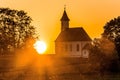 Beautiful view of St. Rupert church also known as Lindach on an orange sunset background