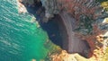 Beautiful view of steep rocky cliff in the sea. Amazing view of the blue sea and rocky shore, drone photo Royalty Free Stock Photo