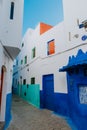 Beautiful view of street with typical arabic architecture in Asilah. Location: Asilah, North Morocco, Africa. Artistic picture. Royalty Free Stock Photo