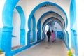 Beautiful view of street with typical arabic architecture in Asilah. Location: Asilah, North Morocco, Africa. Artistic picture. Royalty Free Stock Photo