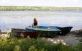 Beautiful view, summer, girl, solitude, riverbank, boats on the shore